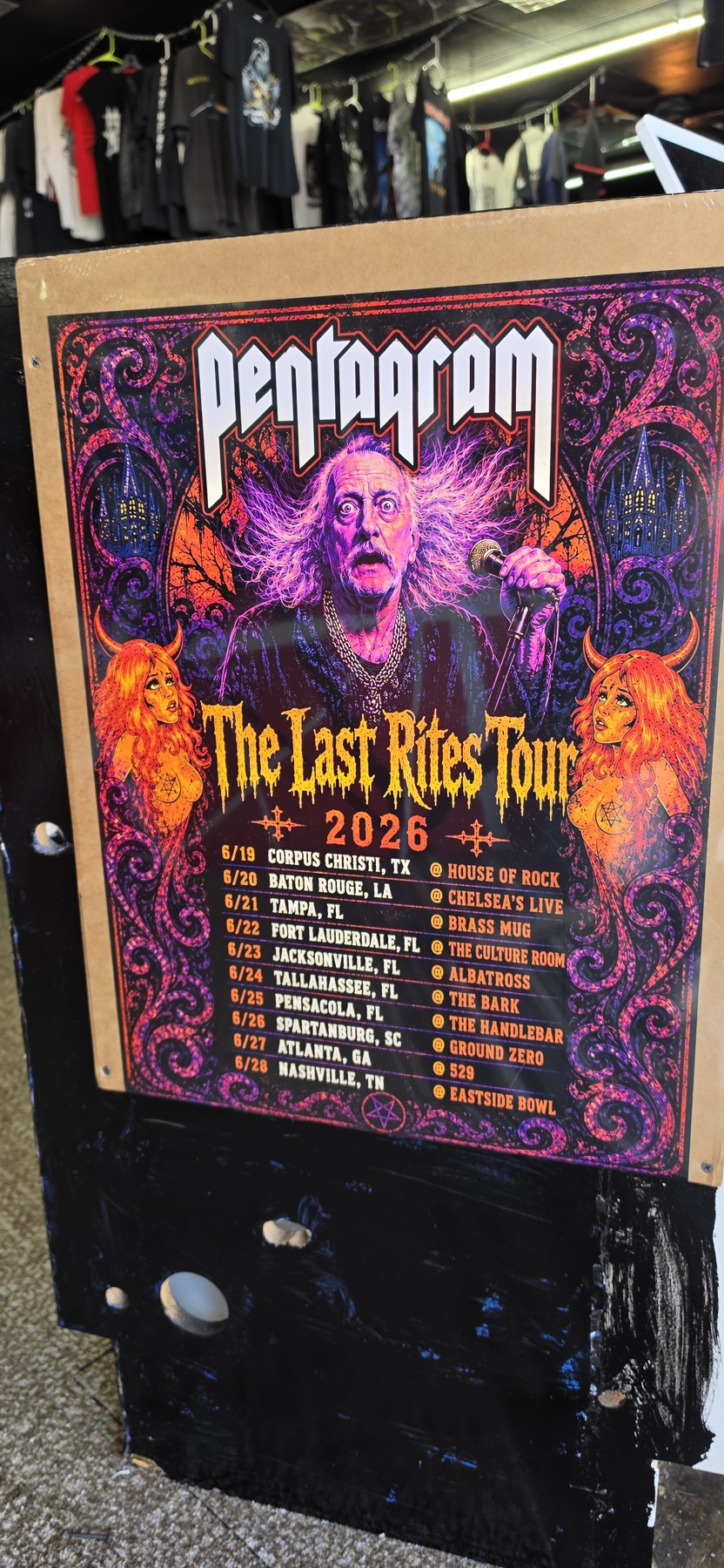 Colorful Pentagram The Last Rites Tour 2026 poster on display in the store